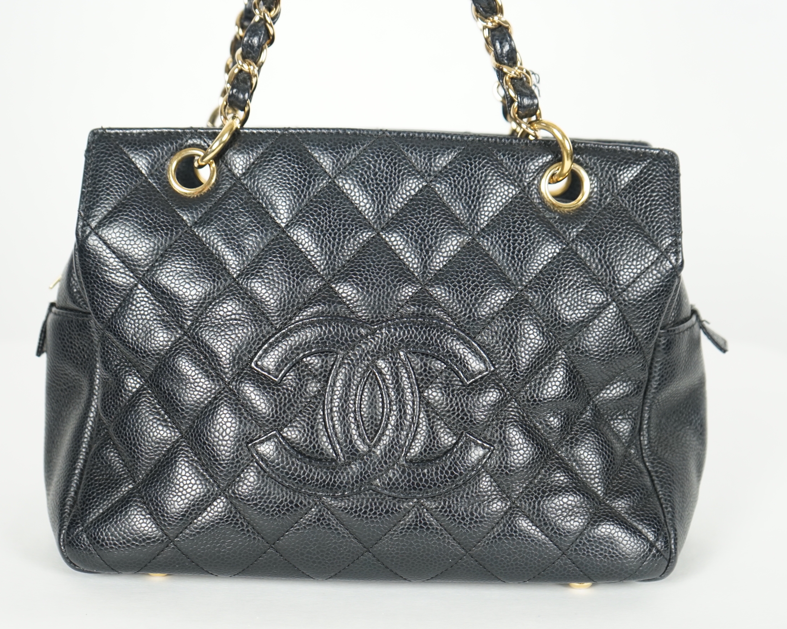 A Chanel Classic Petit Timeless Tote in black caviar with gold hardware, width 26cm, height 19cm, height overall 41cm, depth 13cm., Please note this lot attracts an additional import tax of 20% on the hammer price